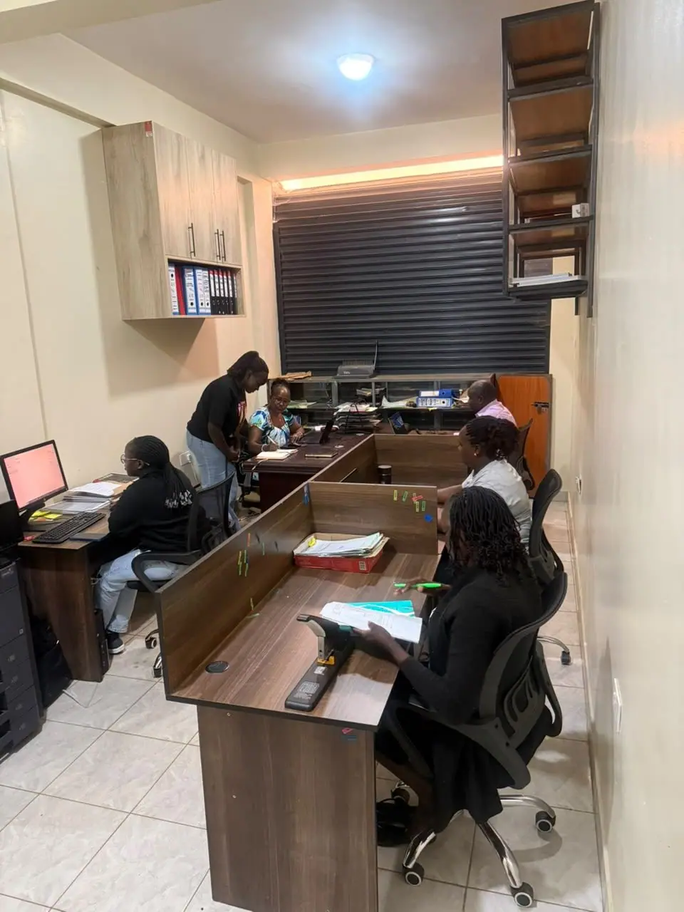 Kerada team members working together at their desks in the Eldoret office